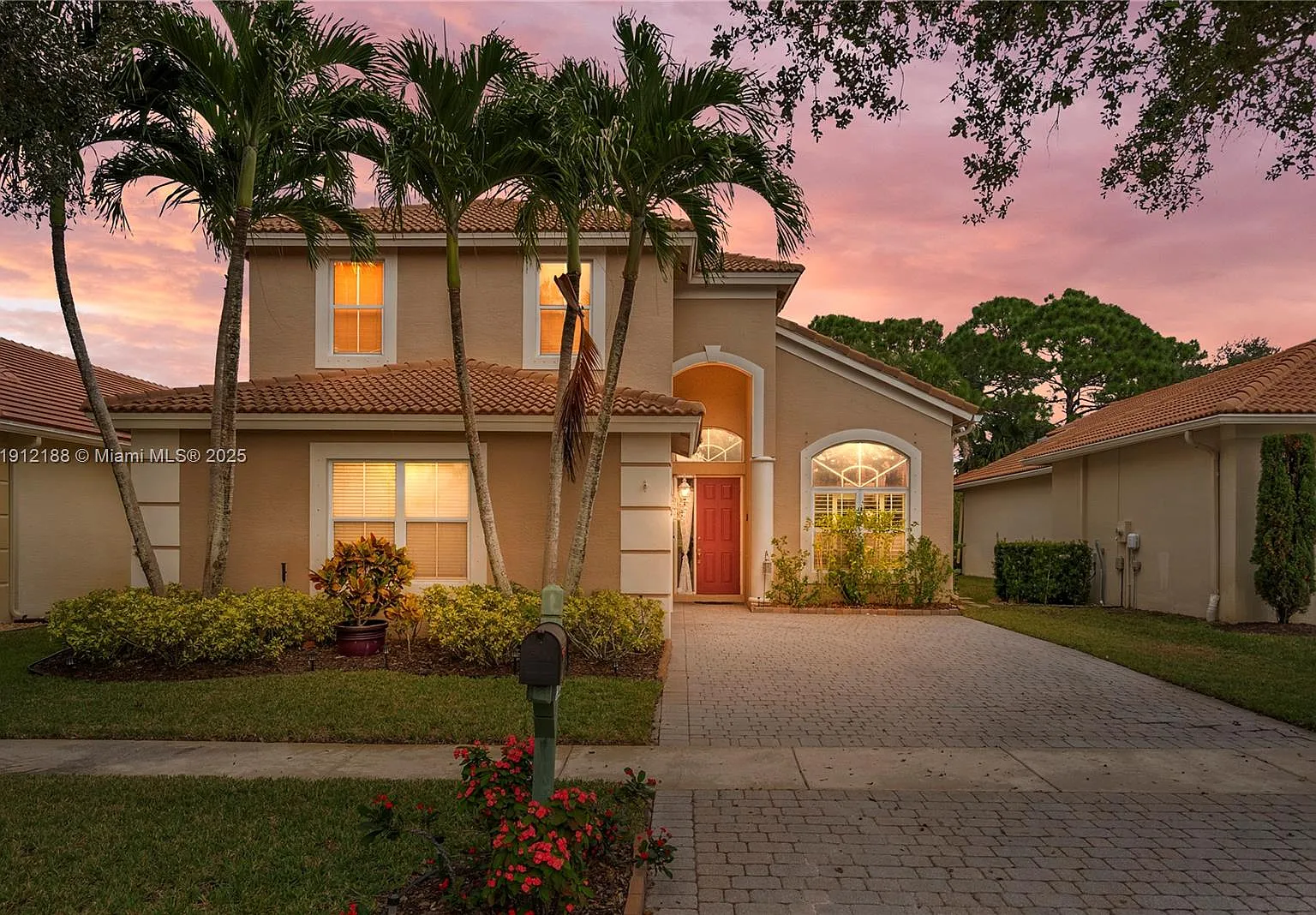 Home in Stuart, Fl sold by AHB for cash. Sunset background and palm trees