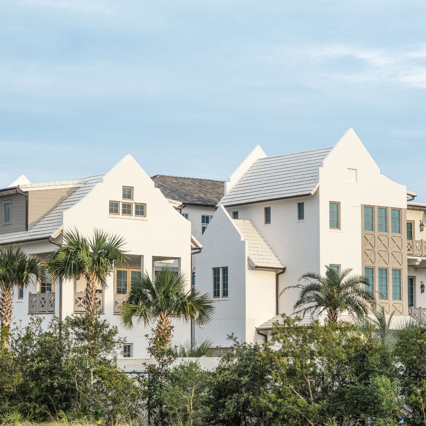 White stone homes back by a blue sky in Hialeah Gardens, Fl