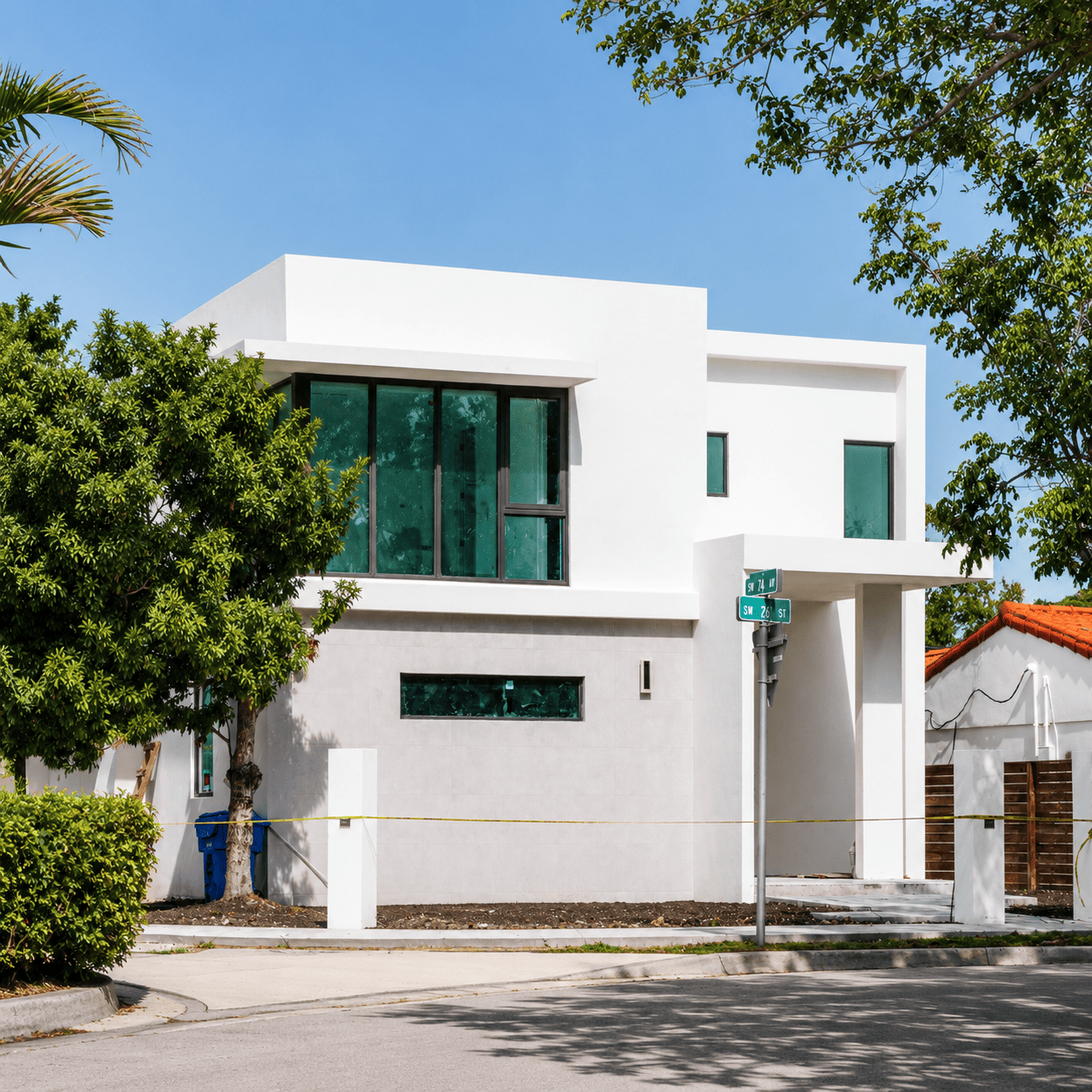 White home in Village Verano, Port St Lucie, Fl. Sunny day and trees view