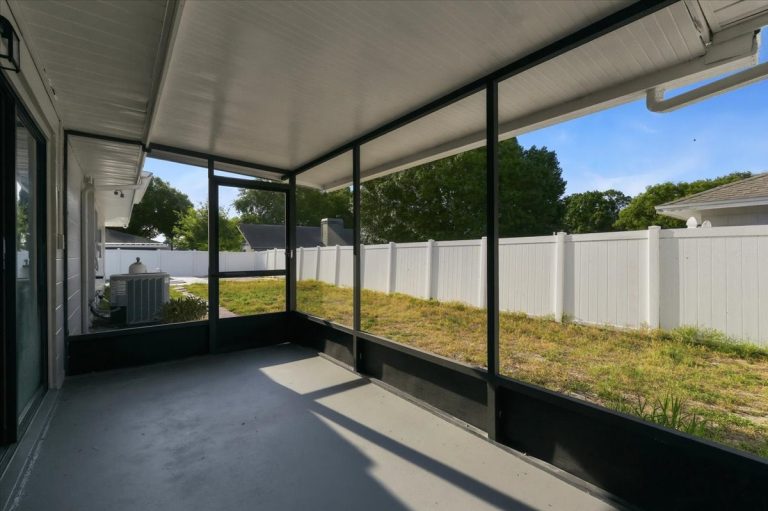 indoor porch in the backyard with black window frames