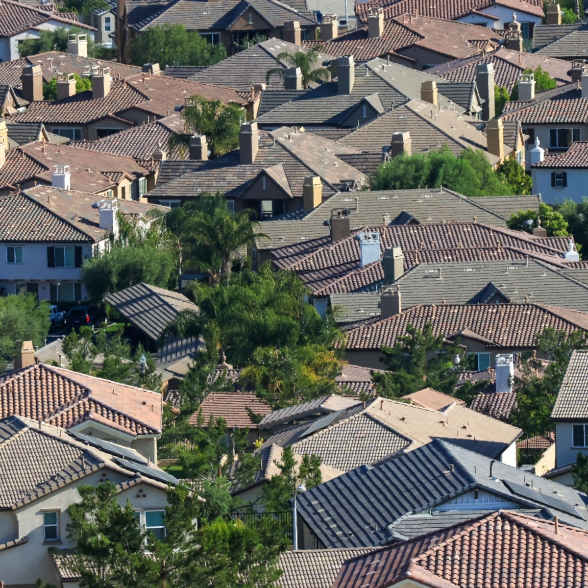 Aerial view of tile-roofed homes in a Deerfield West residential neighborhood