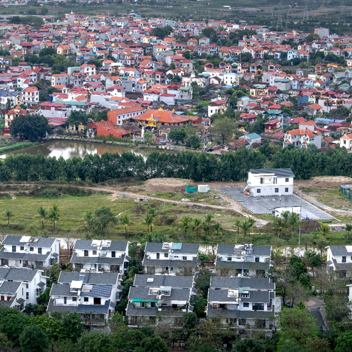 Aerial view of a dense residential neighborhood with a temple in Downtown Lauderdale Lakes