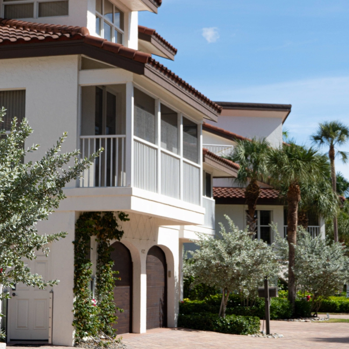editerranean-style townhomes with tile roofs and screened balconies in Kimberly Village, North Lauderdale