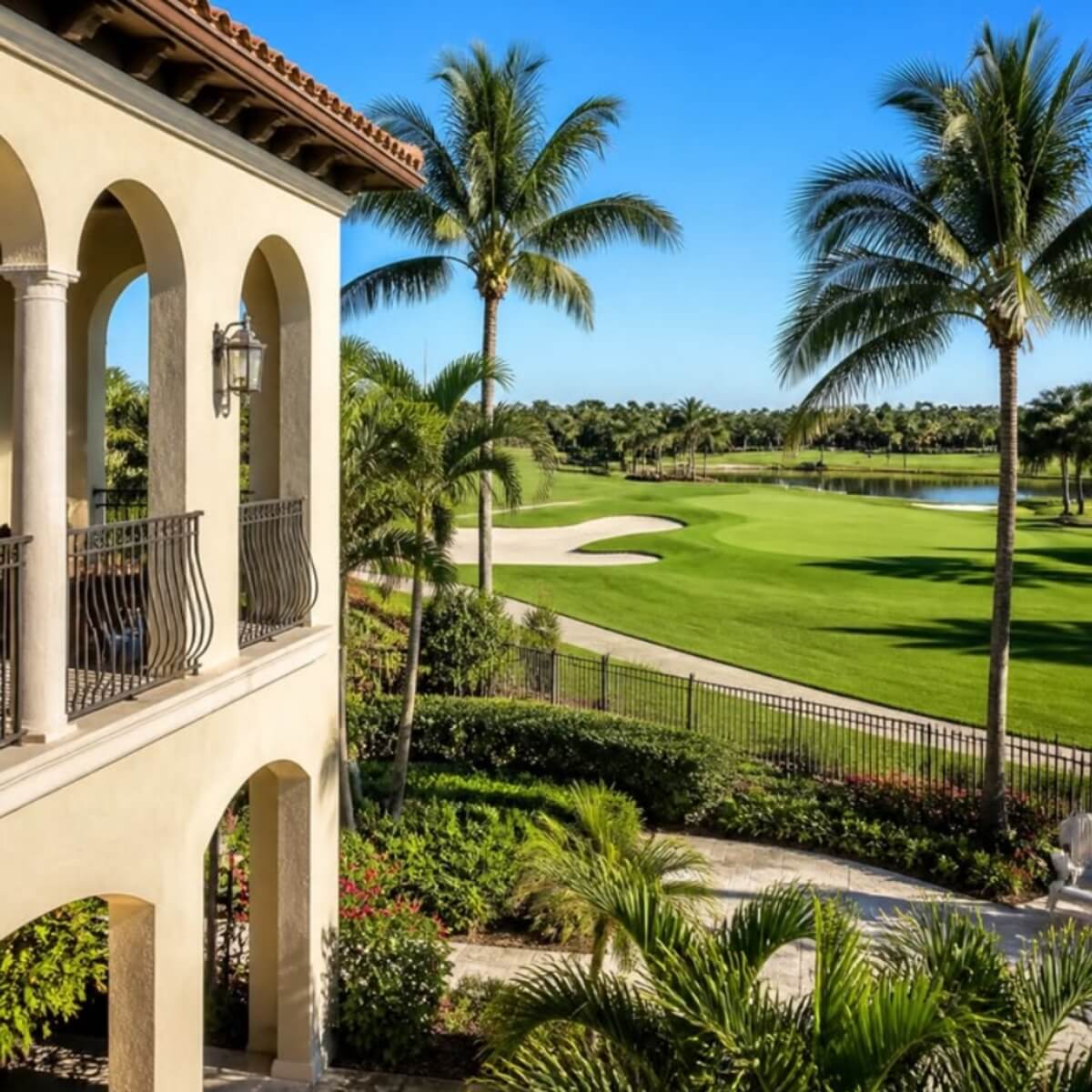 Balcony view overlooking a golf course with palm trees at Kings Point / Hunters Run, Delray Beach