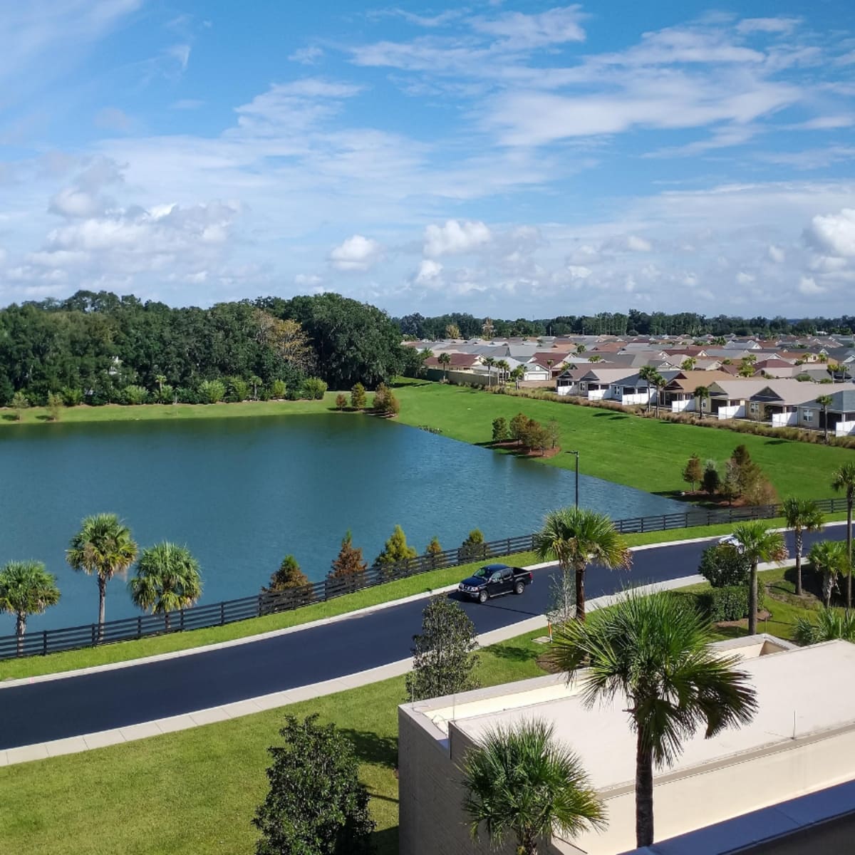 Aerial view of a lakefront residential community in Oriole Estates, Lauderdale Lakes