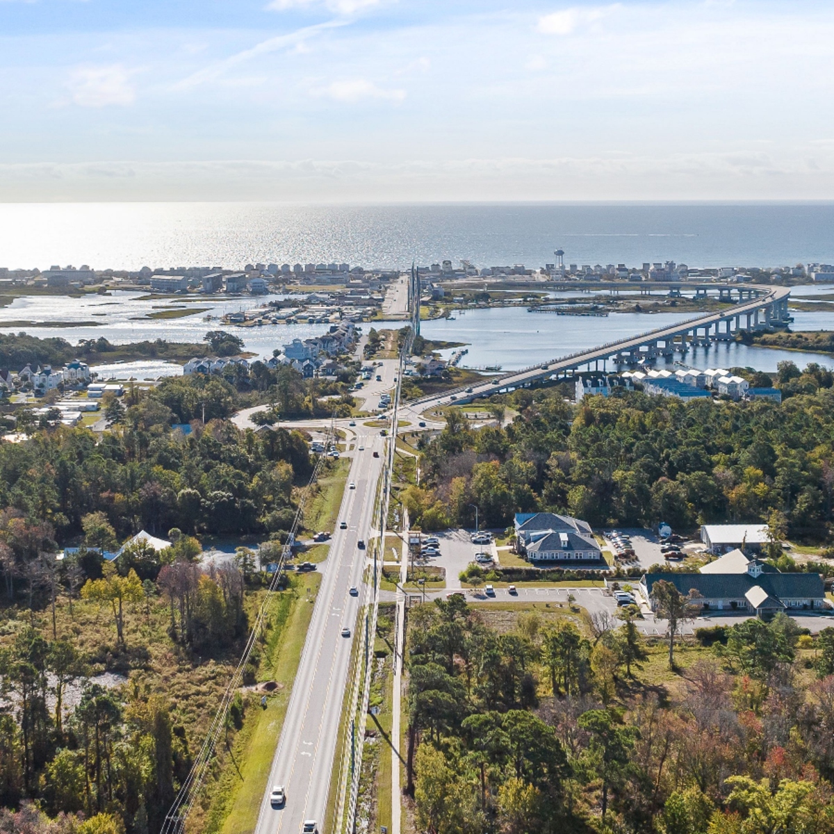 Aerial view of a coastal bridge and waterfront community near South River, Stuart