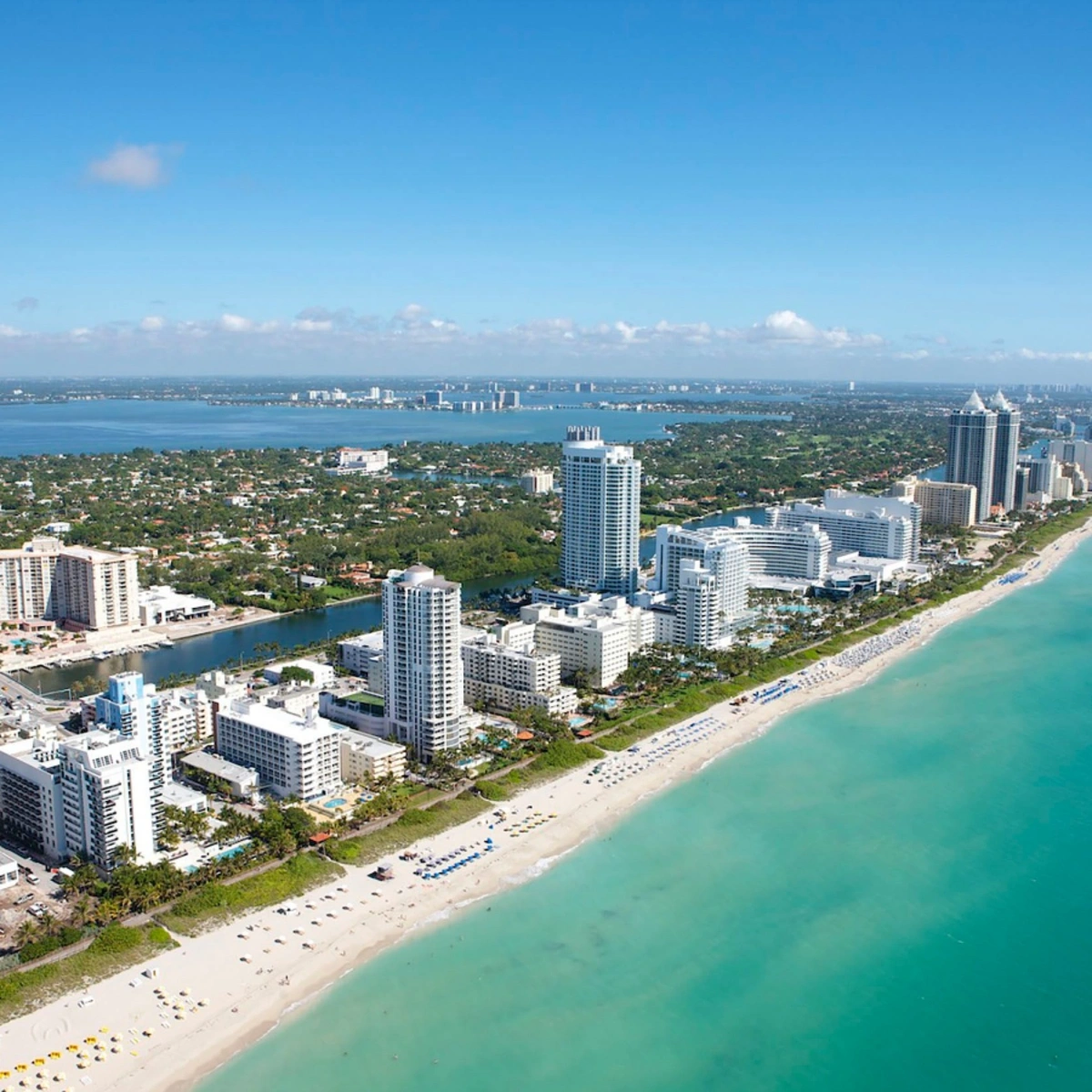 Aerial view of oceanfront high-rise condos and beach in The Cove, Deerfield Beach