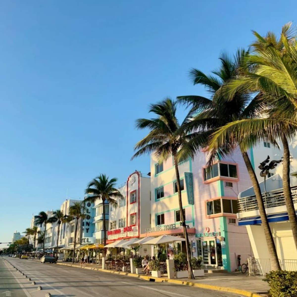 Colorful Art Deco houses lining a palm-tree street in Westlakes, Loxahatchee
